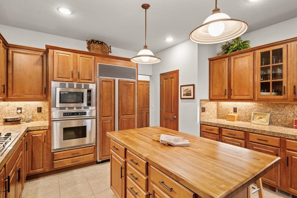 238 Clouds Rest Portola, CA 96122 - Photo 13 of 34 a kitchen with stainless steel appliances a stove refrigerator and microwave