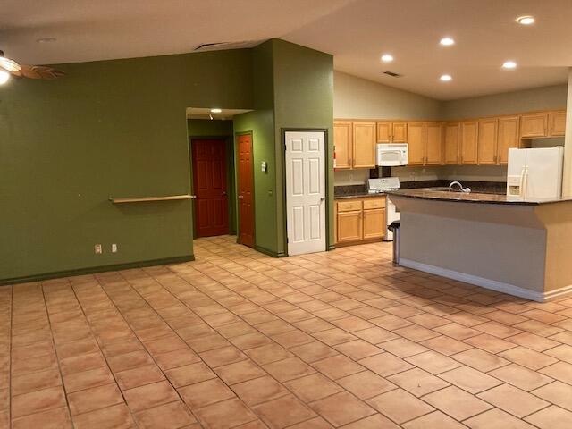 48192 Panorama Avenue Indio, CA 92201 - Photo 13 of 47 a kitchen with stainless steel appliances a refrigerator and a stove top oven