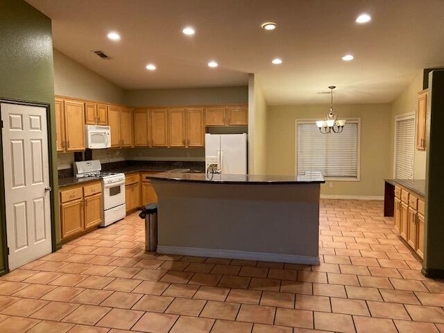 48192 Panorama Avenue Indio, CA 92201 - Photo 14 of 47 a kitchen with stainless steel appliances a stove a sink a microwave a counter top space and cabinets