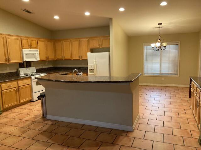 48192 Panorama Avenue Indio, CA 92201 - Photo 15 of 47 a kitchen with a sink a counter space and cabinets