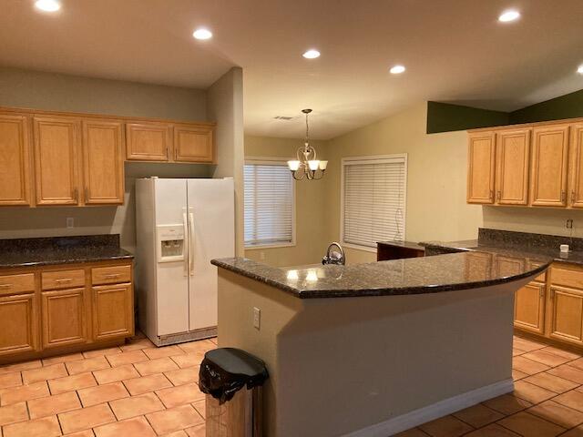 48192 Panorama Avenue Indio, CA 92201 - Photo 16 of 47 a kitchen with a sink a refrigerator and cabinets