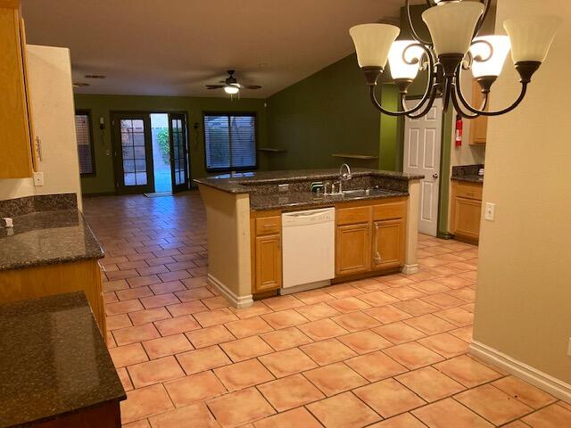 48192 Panorama Avenue Indio, CA 92201 - Photo 17 of 47 a kitchen with stainless steel appliances granite countertop a stove a sink and a microwave