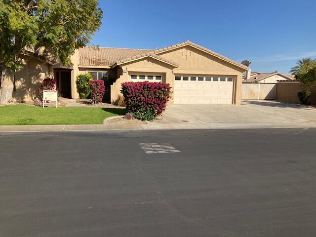 48192 Panorama Avenue Indio, CA 92201 - Photo 2 of 47 a front view of a house with a yard