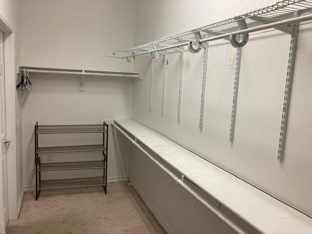 48192 Panorama Avenue Indio, CA 92201 - Photo 24 of 47 a view of walk in closet with empty racks
