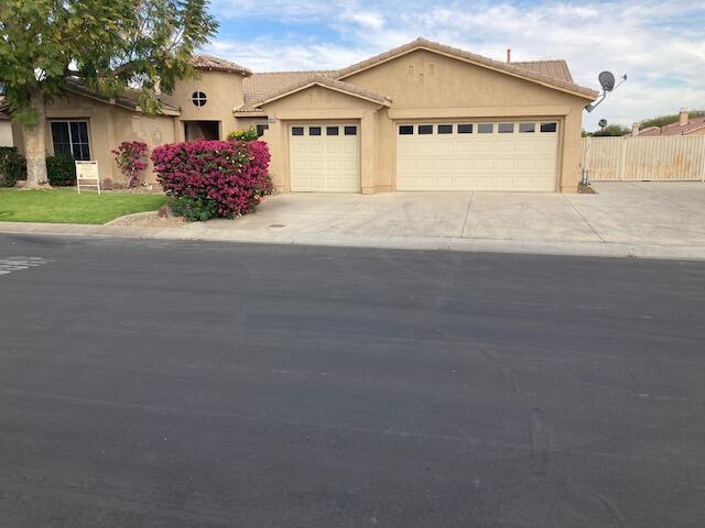 48192 Panorama Avenue Indio, CA 92201 - Photo 3 of 47 a view of a house with a yard and garage