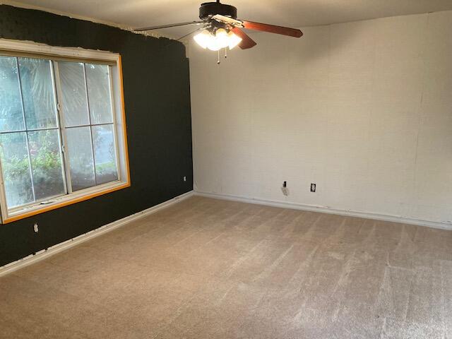 48192 Panorama Avenue Indio, CA 92201 - Photo 33 of 47 a view of a big room with windows and chandelier fan