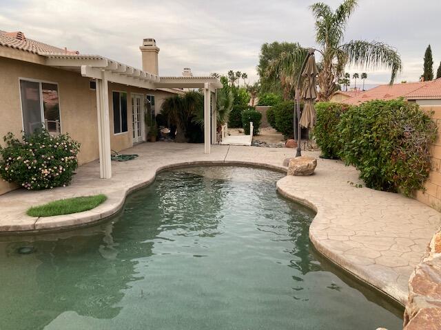 48192 Panorama Avenue Indio, CA 92201 - Photo 37 of 47 a view of a swimming pool with a patio