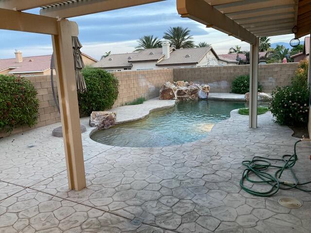 48192 Panorama Avenue Indio, CA 92201 - Photo 40 of 47 a view of a patio with table and chairs potted plants