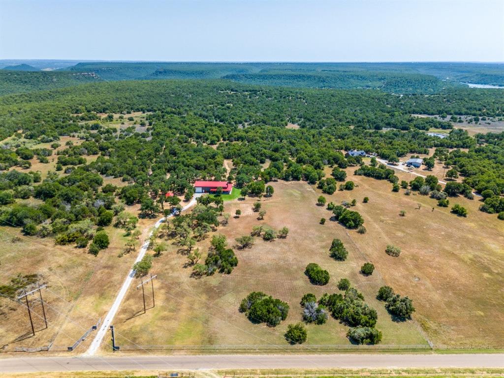 385 Brown Road Palo Pinto, TX 76484 - Photo 17 of 18 a view of a yard with an outdoor space