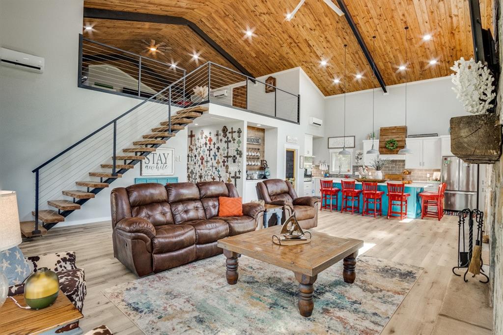 385 Brown Road Palo Pinto, TX 76484 - Photo 2 of 18 a outdoor living space with patio furniture and a potted plant