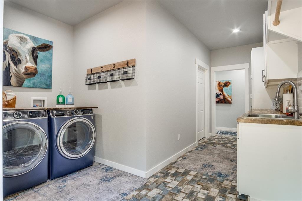 385 Brown Road Palo Pinto, TX 76484 - Photo 7 of 18 a utility room with sink dryer and washer