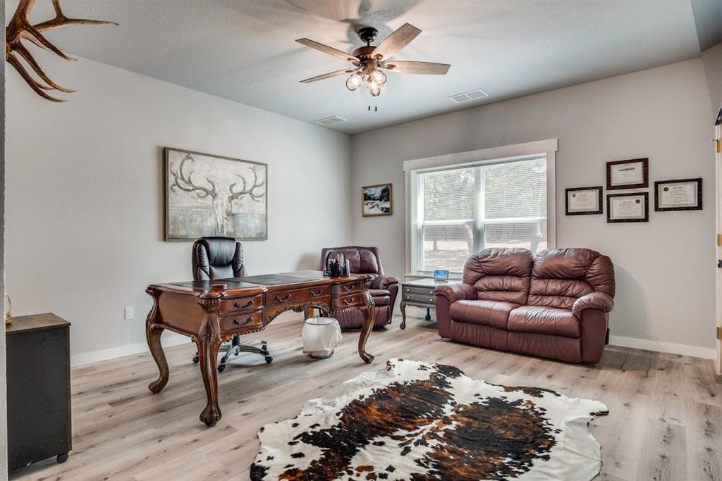 385 Brown Road Palo Pinto, TX 76484 - Photo 8 of 18 a living room with furniture and a window