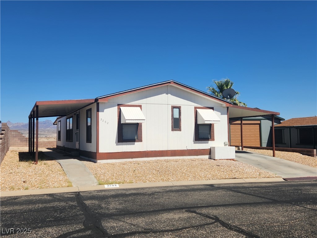 3262 Del Monte Street Laughlin, NV 89029 - Photo 4 of 42 View of side of property with a carport