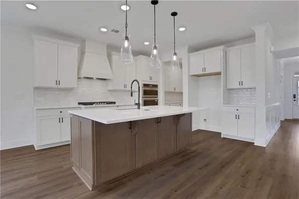 a bathroom with a granite countertop cabinets and a stove