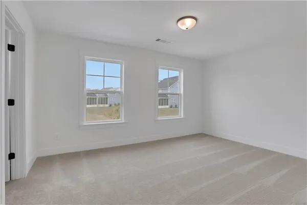 a view of a table and chairs in the garden