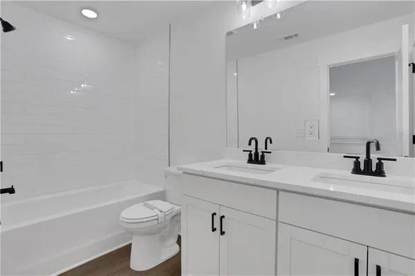 a view of a livingroom with furniture and closet area