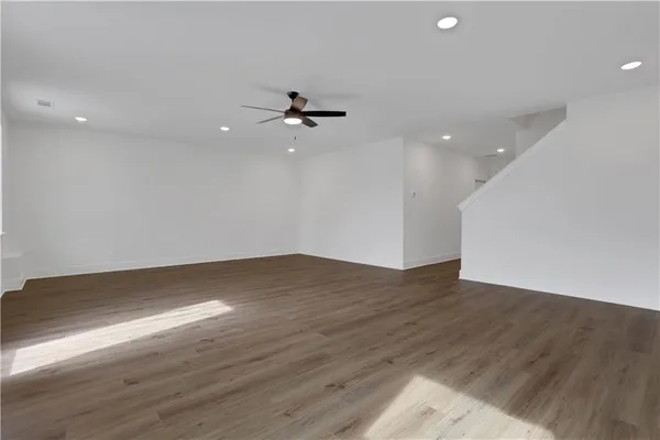 a view of a house with a yard balcony and sitting area