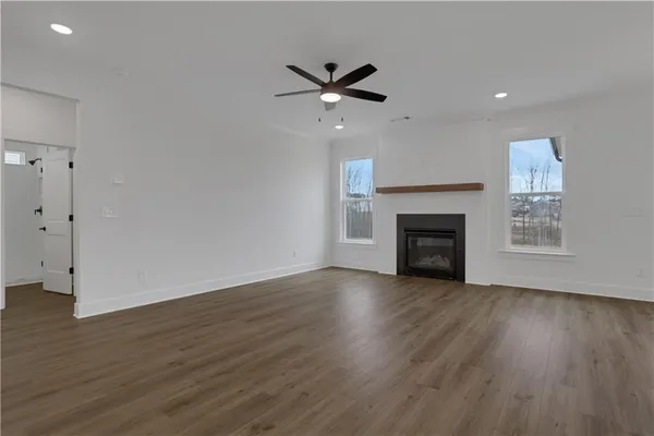 a view of kitchen with sink and wooden floor