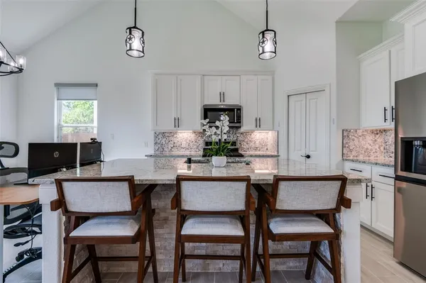 a dining room with furniture and window