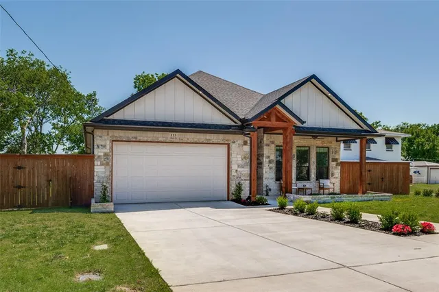 a front view of a house with garden