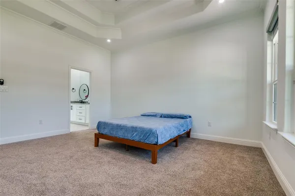 a room with a bed and a window