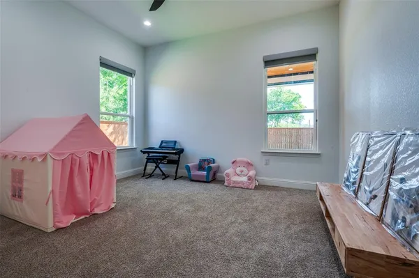 a bedroom with bed and a window