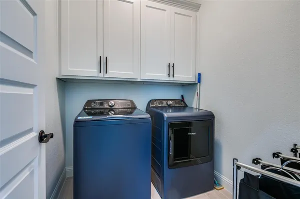 a kitchen with a stove and a refrigerator