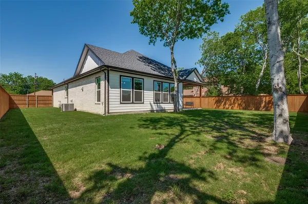 a front view of house with garden