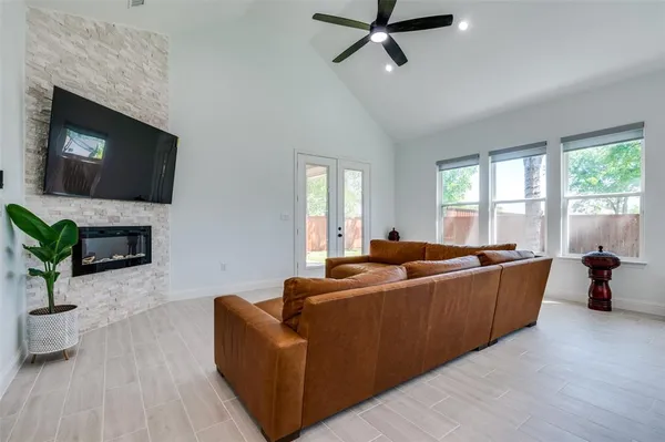 a living room with furniture and a flat screen tv