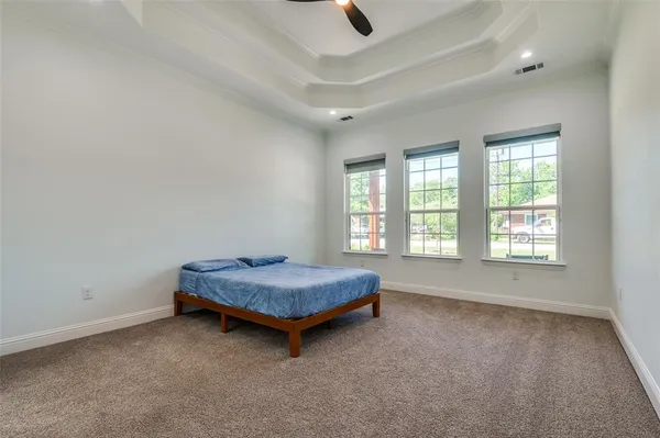 a living room with a bed furniture and a window