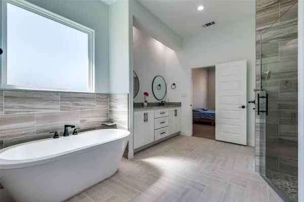 a bathroom with a bathtub sink and toilet