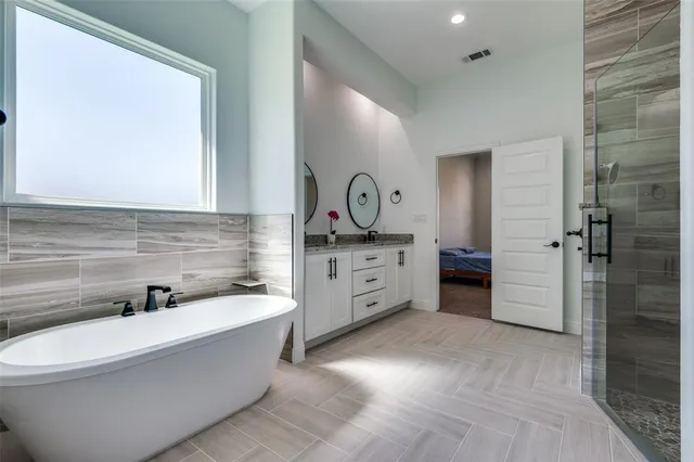 a bathroom with a bathtub sink and toilet