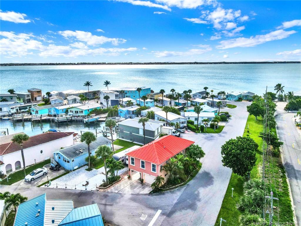 10701 South Ocean Drive, Unit 855 Jensen Beach, FL 34957 - Photo 3 of 67 a view of a lake with a patio