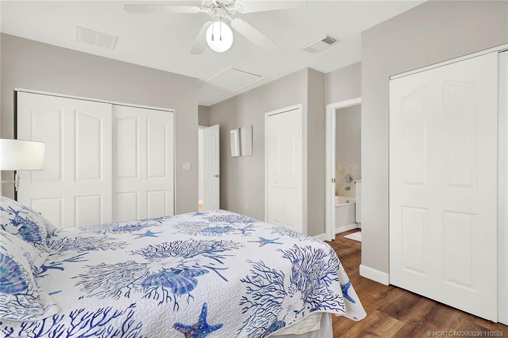 10701 South Ocean Drive, Unit 855 Jensen Beach, FL 34957 - Photo 34 of 67 a bedroom with a bed and a lamp