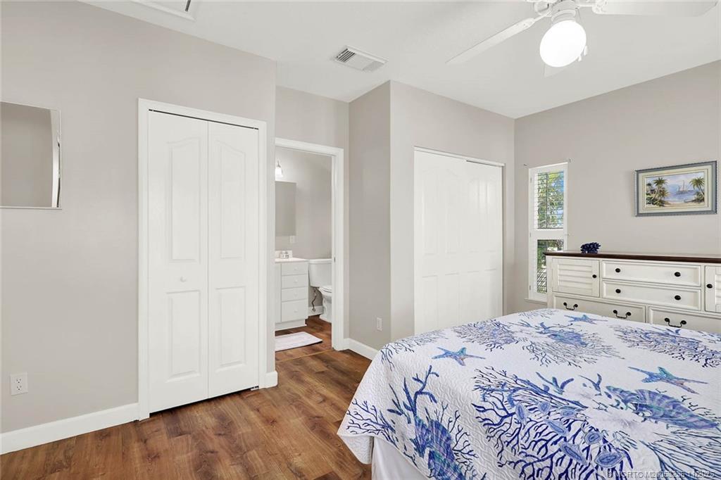 10701 South Ocean Drive, Unit 855 Jensen Beach, FL 34957 - Photo 35 of 67 a bedroom with a bed and a mirror