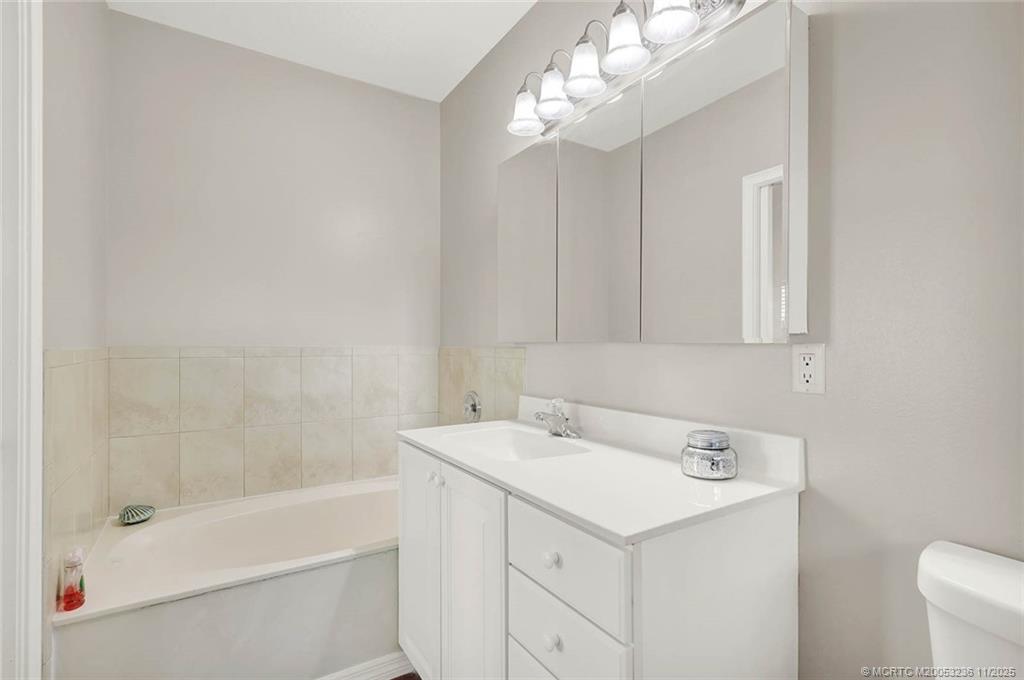10701 South Ocean Drive, Unit 855 Jensen Beach, FL 34957 - Photo 37 of 67 a bathroom with a sink a toilet and shower