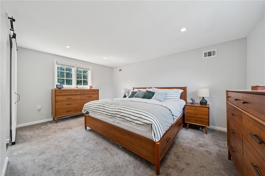 2415 Collins Road Pittsburgh, PA 15235 - Photo 16 of 32 a spacious bedroom with a bed and window