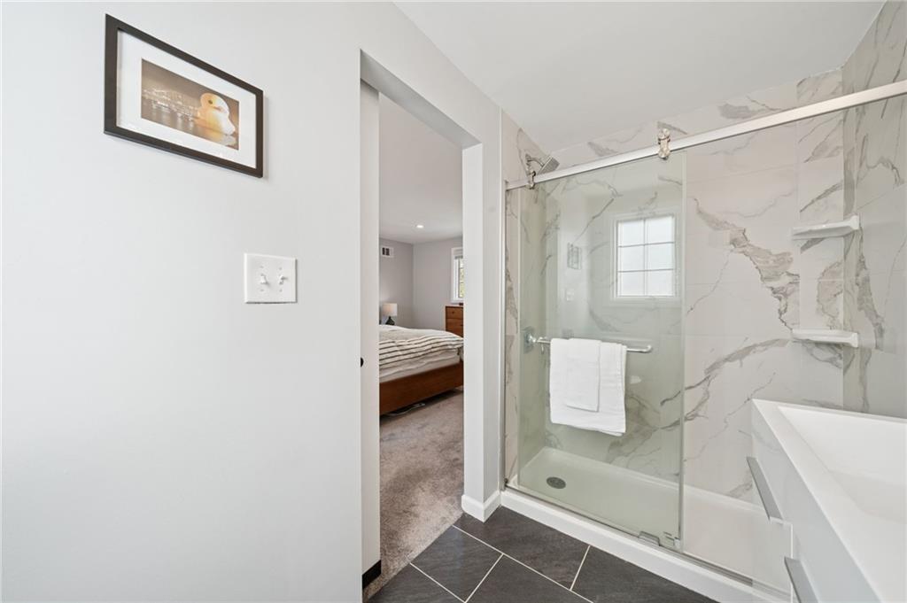 2415 Collins Road Pittsburgh, PA 15235 - Photo 19 of 32 a en suite bathroom with a shower and a sink