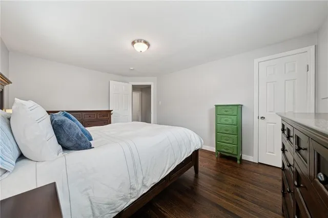 a bedroom with a bed and a closet