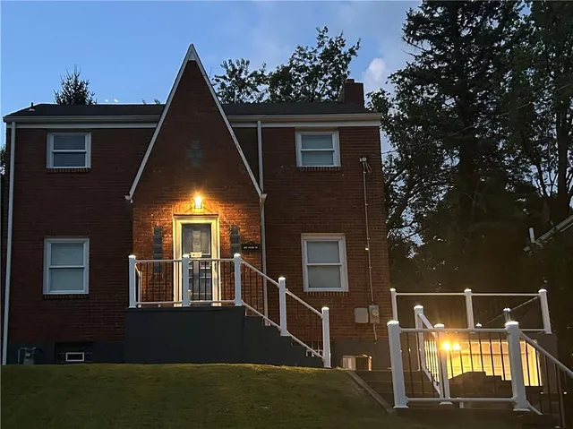 a front view of a house with parking