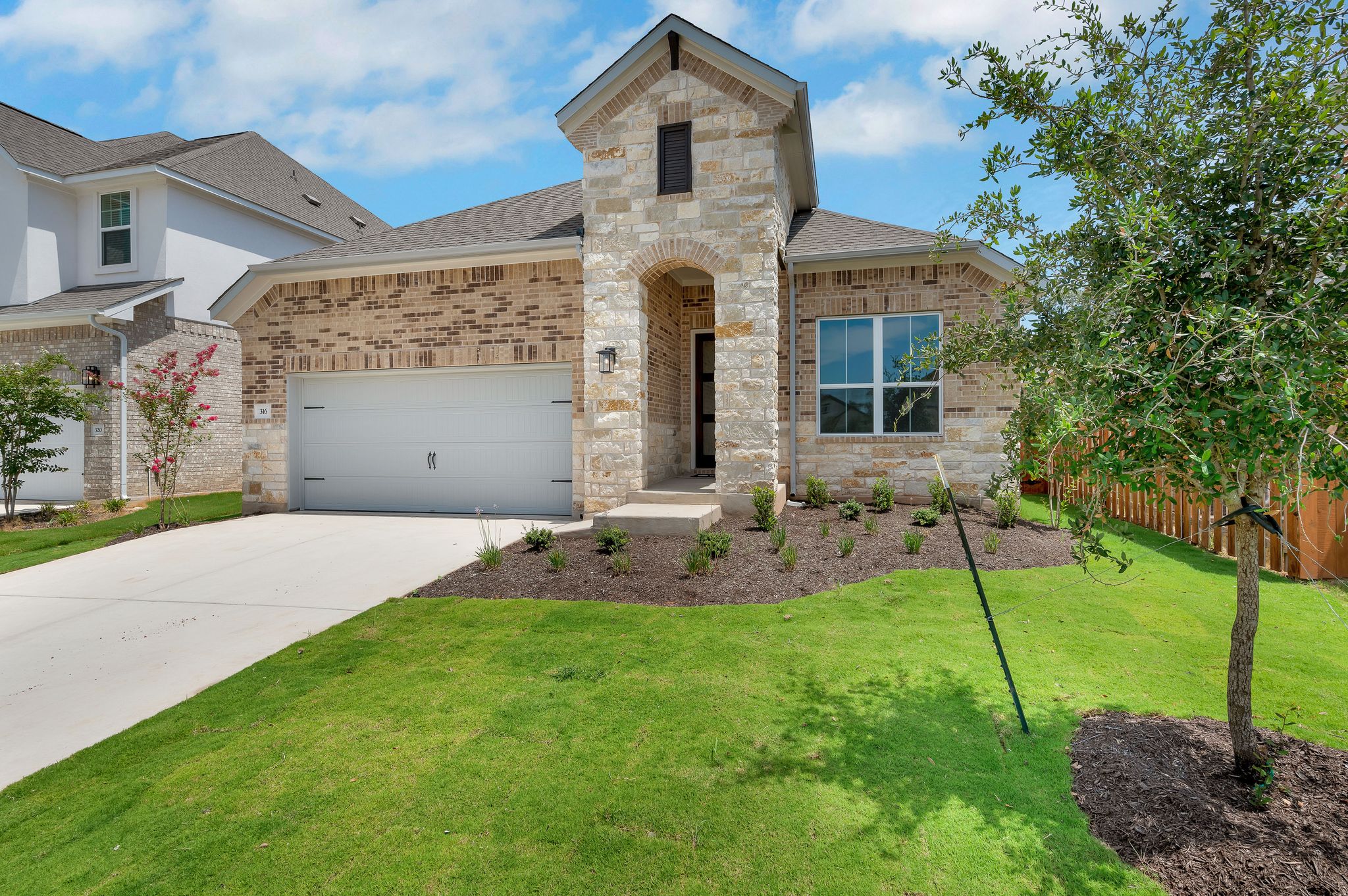 316 Millbend Road Georgetown, TX 78633 - Photo 1 of 1 French country home with roof with shingles, driveway, and brick siding