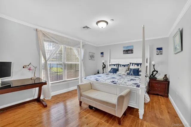 a view of a livingroom with furniture and a window