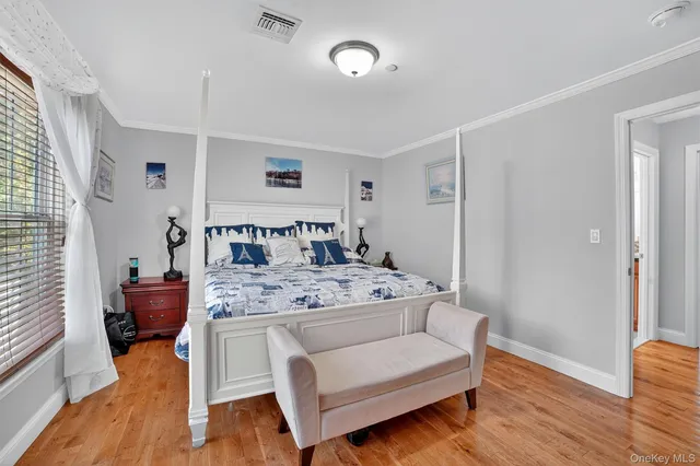 a view of living room with furniture and wooden floor