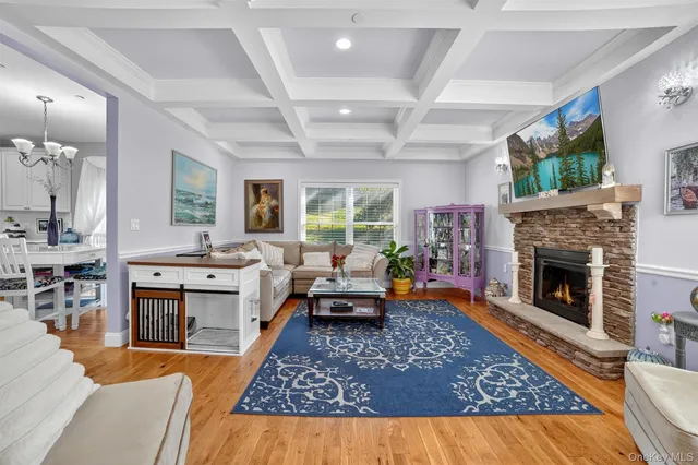 a living room with furniture flat screen tv and a fireplace