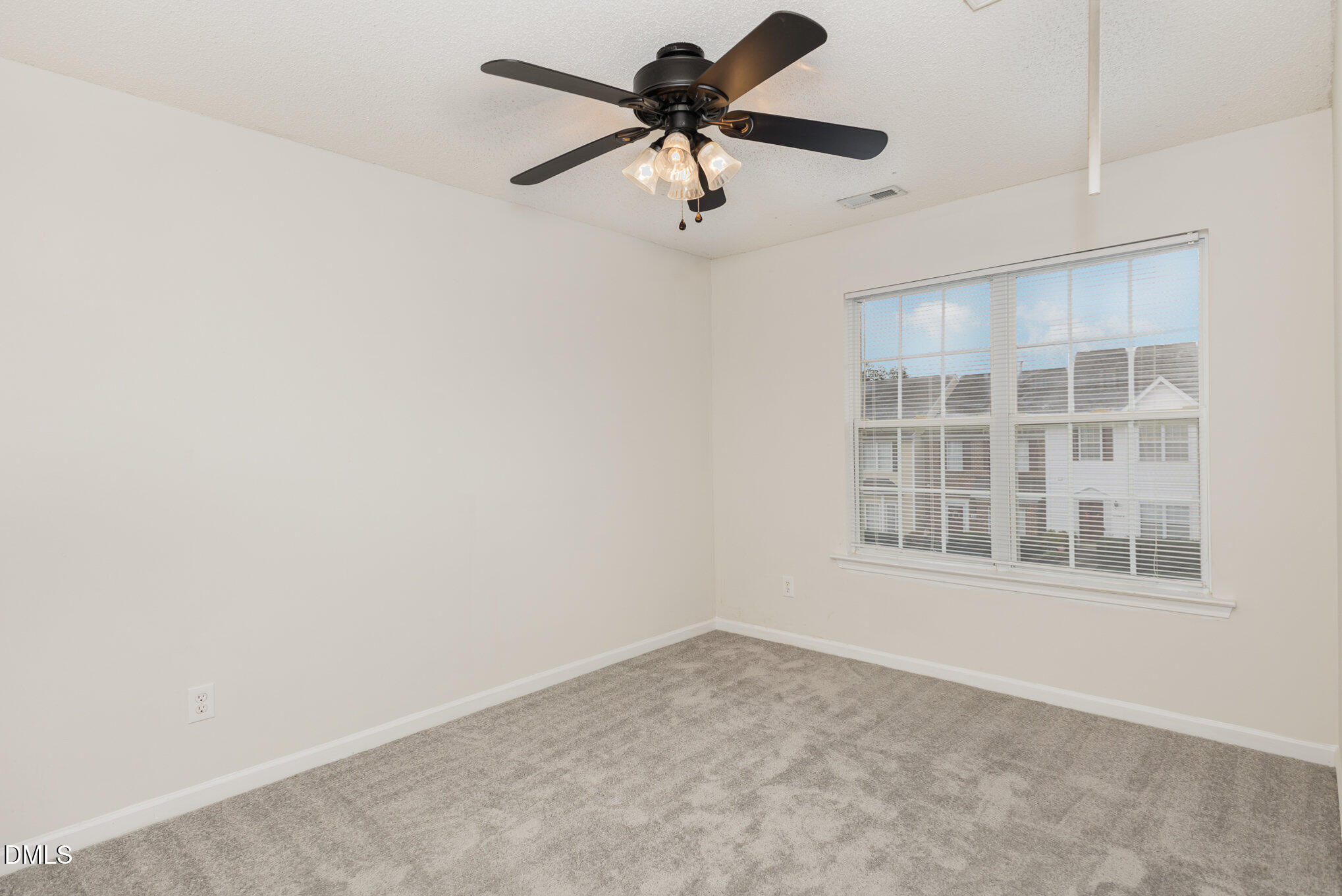 10947 Pendragon Place Raleigh, NC 27614 - Photo 13 of 21 an empty room with a window and a fan