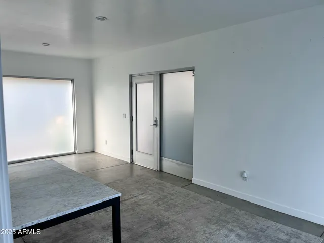 an empty room with sliding door