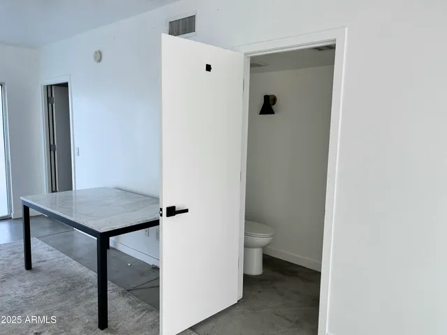 a bathroom with a toilet and a vanity