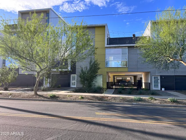 a building exterior with stairs and windows