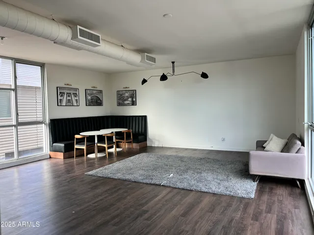 a workspace with furniture and wooden floor