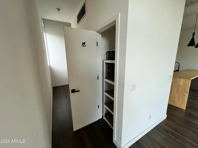 a white toilet sitting next to a shower